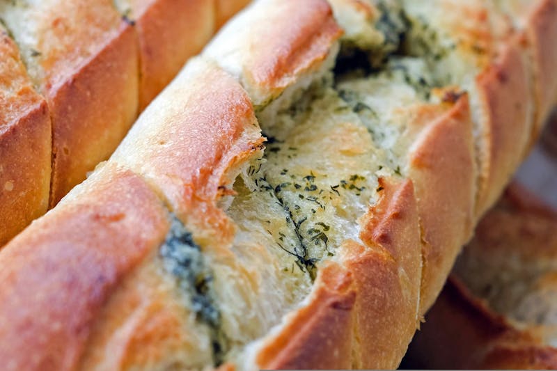 Garlic Dough Balls starter with herb butter dipping sauce
