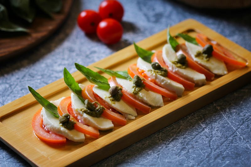 Caprese Salad starter with buffalo mozzarella and heritage tomatoes