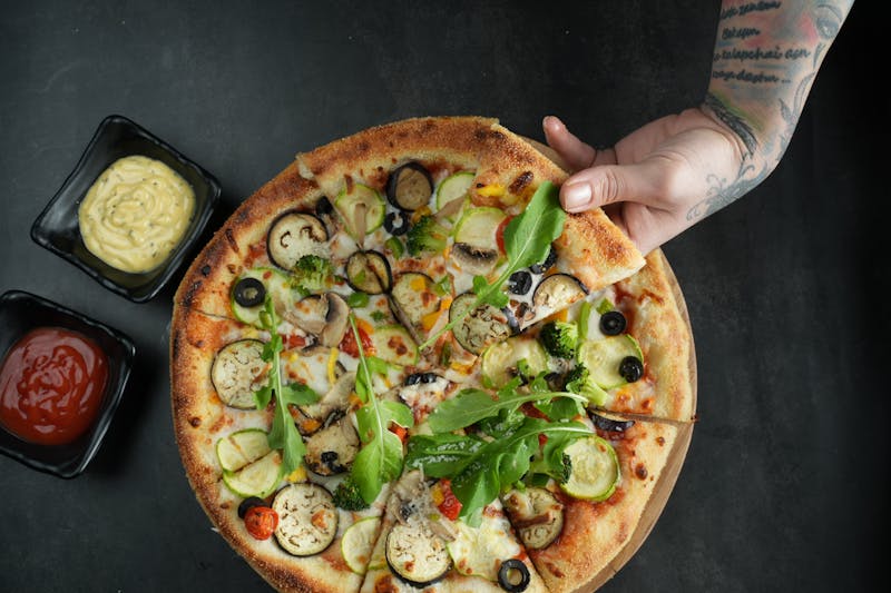 Veggie Delight pizza with colourful fresh vegetables at Apache Pizza